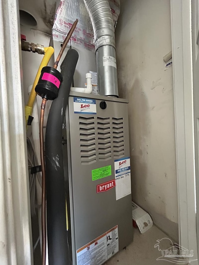 utility room featuring heating unit