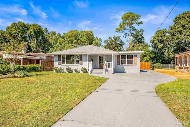 ranch-style home with a front lawn and a porch