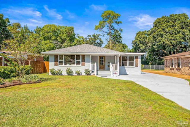 single story home featuring a front lawn and covered porch