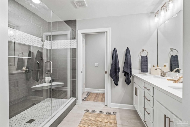 bathroom with vanity, hardwood / wood-style floors, and an enclosed shower