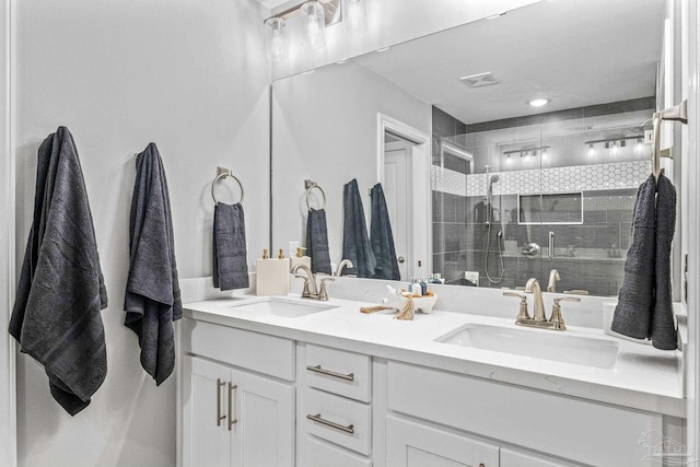 bathroom with vanity and a shower with shower door