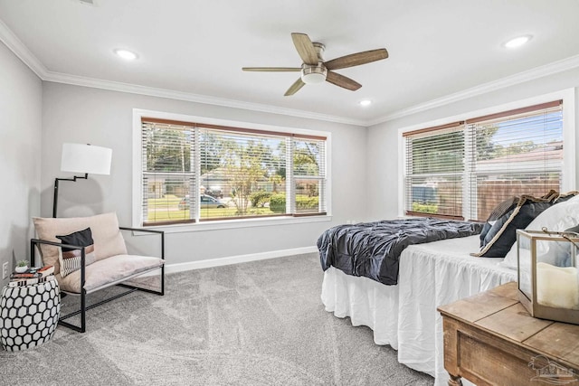 carpeted bedroom featuring crown molding and ceiling fan