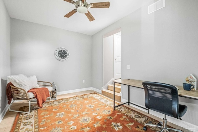 office with ceiling fan and hardwood / wood-style flooring