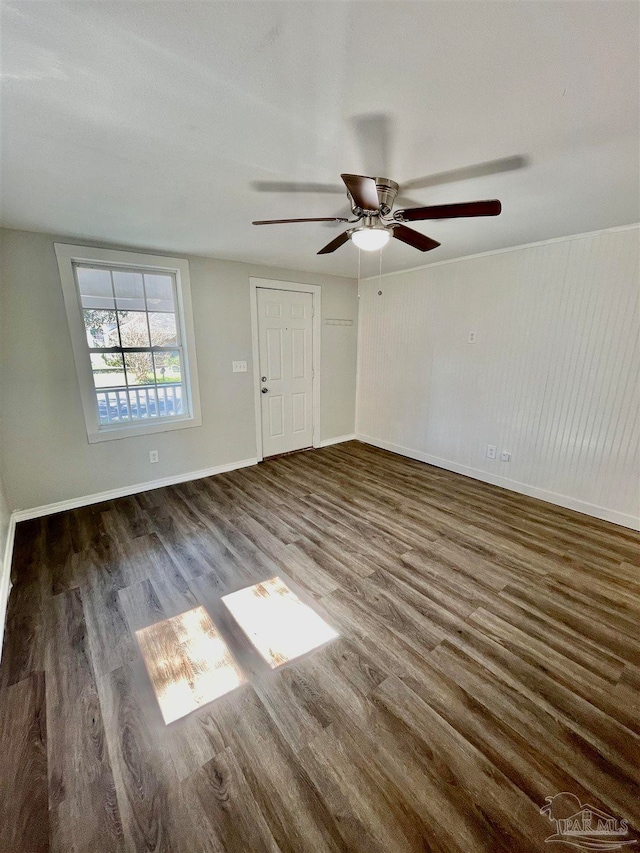 empty room featuring ceiling fan and hardwood / wood-style floors