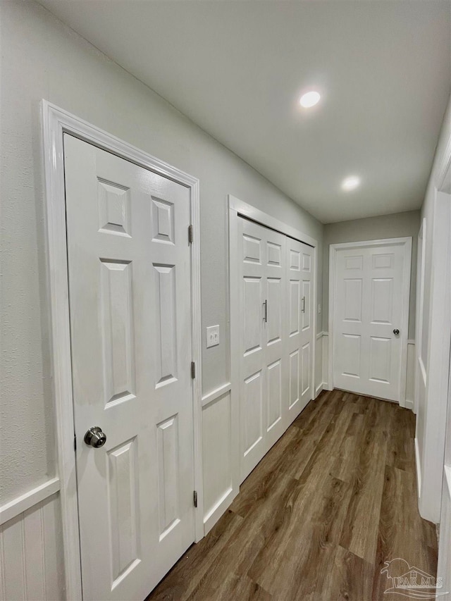 hall with hardwood / wood-style flooring