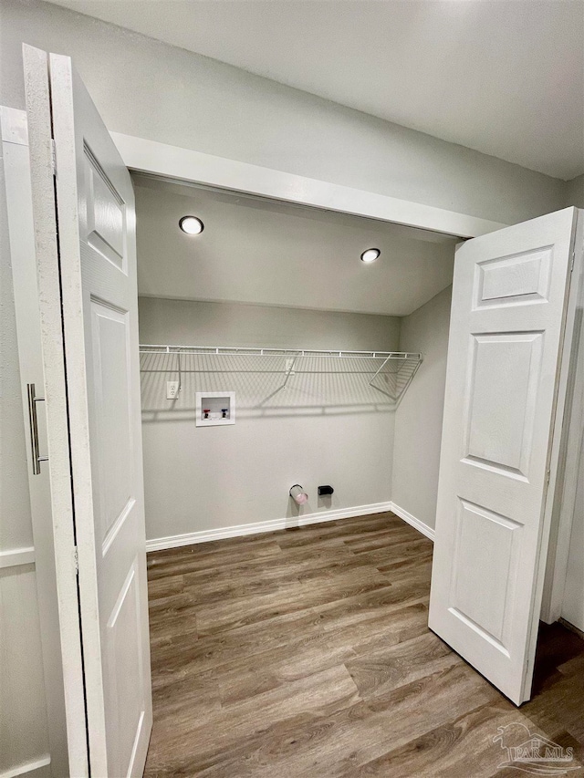 laundry room featuring hardwood / wood-style floors and washer hookup