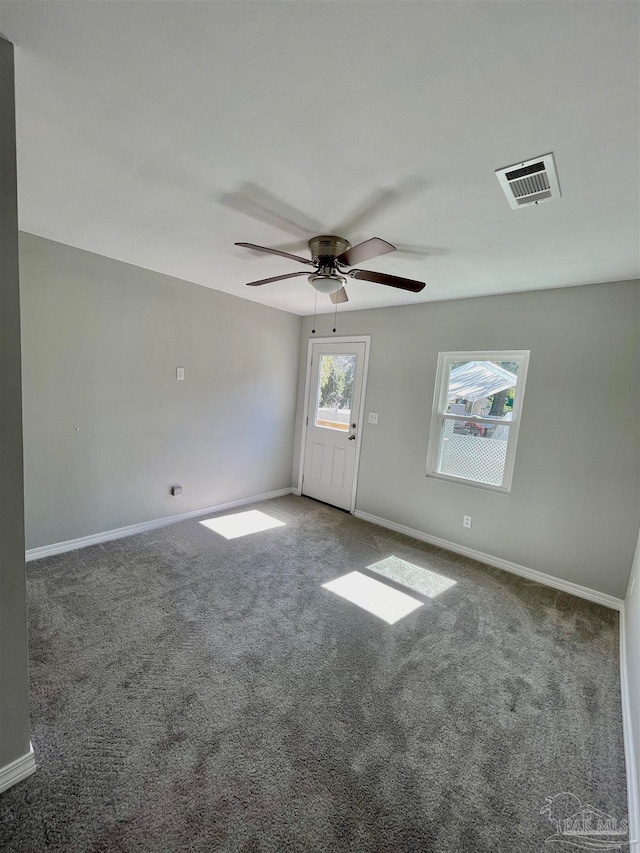 carpeted empty room with ceiling fan