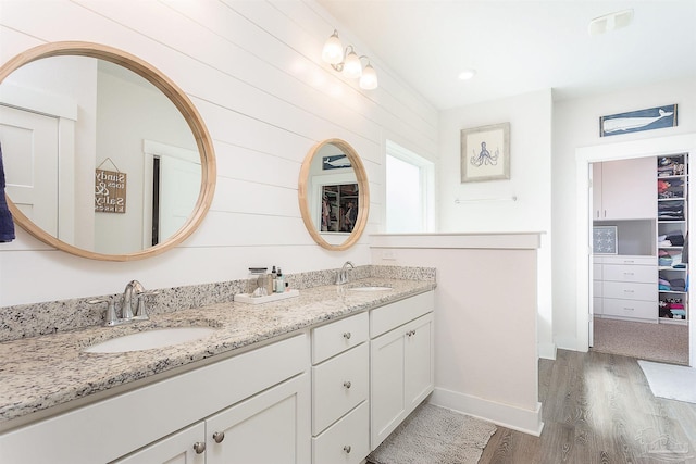 3564 Sailfish Dr, Gulf Breeze, FL 32563 - full bathroom with wood finished floors and double vanity