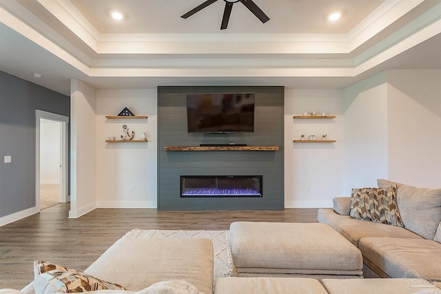 3564 Sailfish Dr, Gulf Breeze, FL 32563 - living room with a tray ceiling, a ceiling fan, wood finished floors, ornamental molding, and recessed lighting