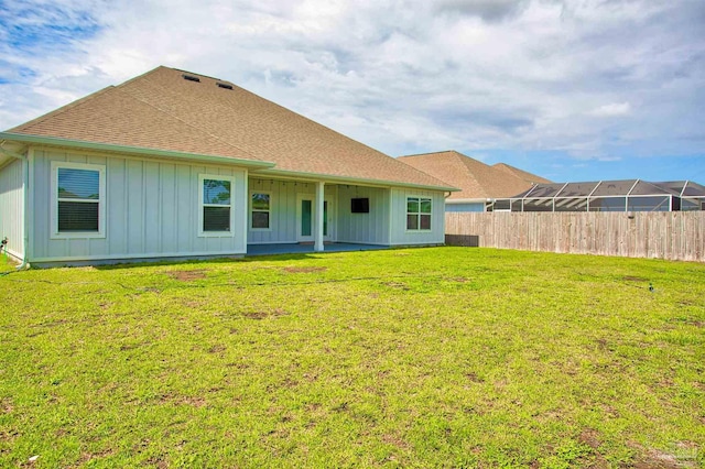 3564 Sailfish Dr, Gulf Breeze, FL 32563 - back of house with board and batten siding, a shingled roof, and a patio area