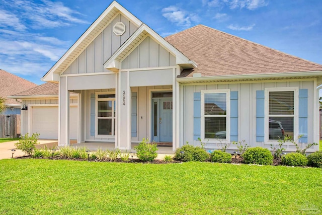 3564 Sailfish Dr, Gulf Breeze, FL 32563 - view of front of property featuring board and batten siding, roof with shingles, an attached garage, a porch, and concrete driveway