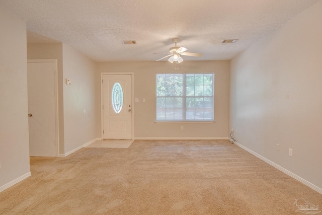 4117 Pace Ln, Pace, FL 32571 - foyer entrance with a ceiling fan, light carpet, and a textured ceiling