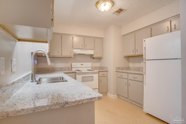 4117 Pace Ln, Pace, FL 32571 - kitchen with white appliances, under cabinet range hood, light countertops, light flooring, and a textured ceiling