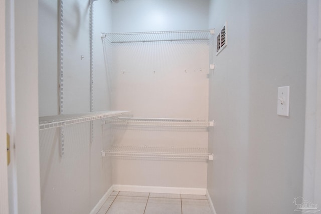 4117 Pace Ln, Pace, FL 32571 - walk in closet featuring light tile patterned flooring