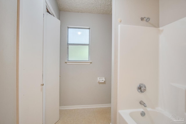 4117 Pace Ln, Pace, FL 32571 - full bath with tub / shower combination and a textured ceiling