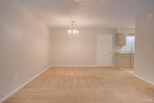 4117 Pace Ln, Pace, FL 32571 - unfurnished room featuring light colored carpet, a chandelier, a textured ceiling, a smoke detector, and ceiling fan