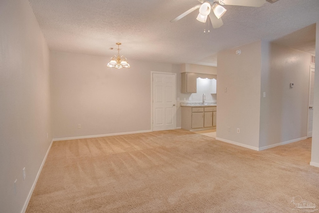 4117 Pace Ln, Pace, FL 32571 - unfurnished living room featuring light carpet, a ceiling fan, a textured ceiling, and a chandelier