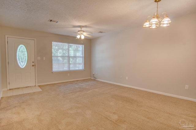 4117 Pace Ln, Pace, FL 32571 - entrance foyer featuring light carpet, a chandelier, a ceiling fan, and a textured ceiling
