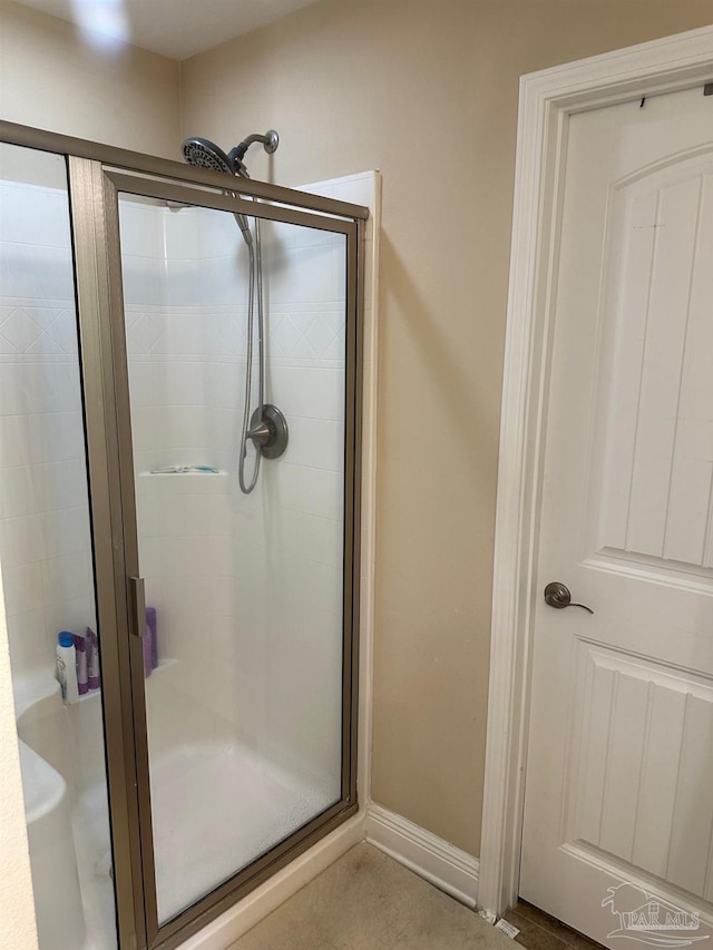 full bathroom featuring a shower stall