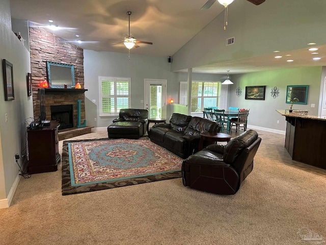 carpeted living room with a ceiling fan, baseboards, a fireplace, high vaulted ceiling, and recessed lighting