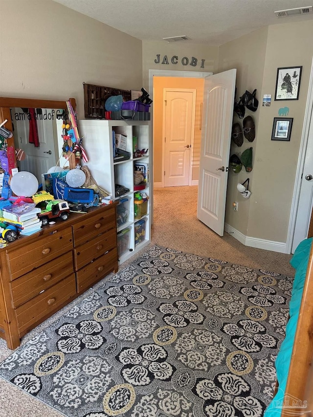 carpeted bedroom with baseboards