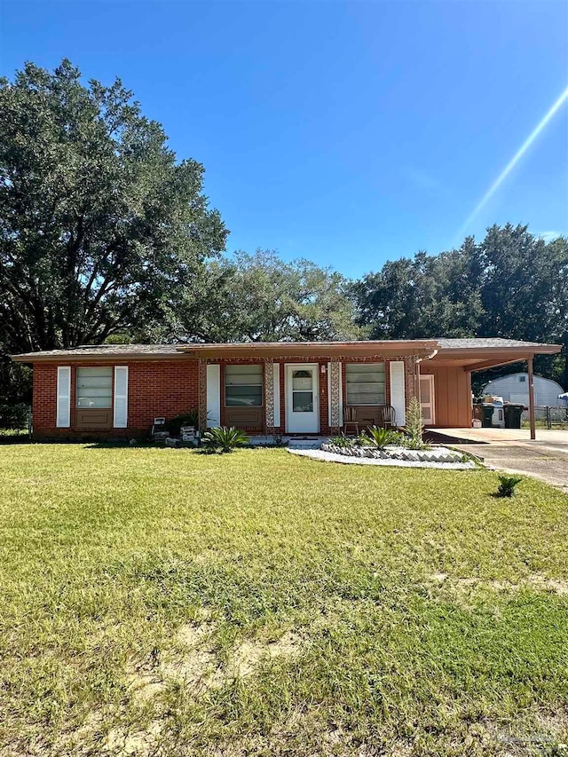 single story home with a carport and a front yard