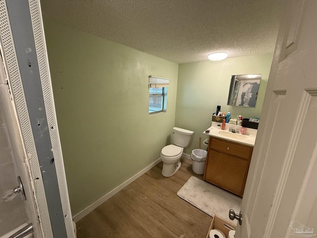 1159 Twin Bridges Rd, Flomaton, AL 36441 - half bathroom with wood finished floors, vanity, and a textured ceiling