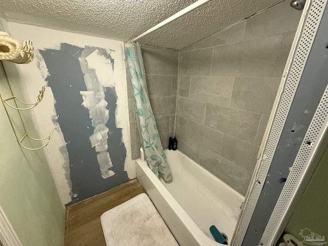 1159 Twin Bridges Rd, Flomaton, AL 36441 - full bathroom featuring shower / bath combination with curtain, wood finished floors, and a textured ceiling