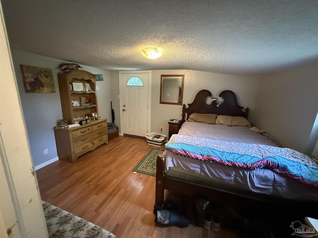 1159 Twin Bridges Rd, Flomaton, AL 36441 - bedroom featuring light wood-style flooring and a textured ceiling