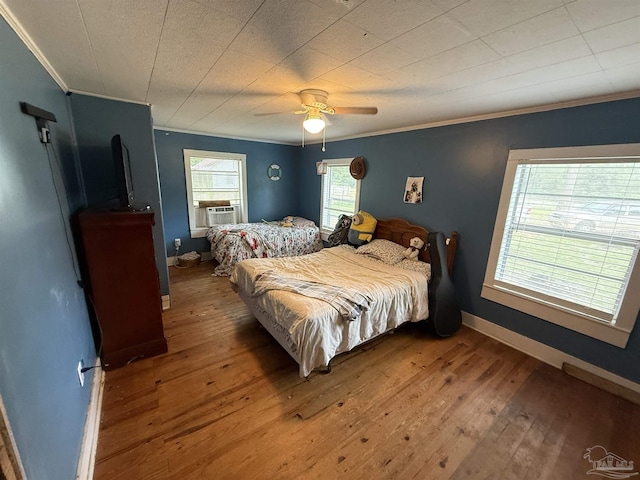 1159 Twin Bridges Rd, Flomaton, AL 36441 - bedroom with ornamental molding, wood-type flooring, ceiling fan, and cooling unit