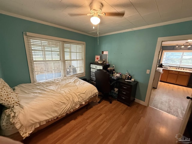 1159 Twin Bridges Rd, Flomaton, AL 36441 - bedroom with light wood-style flooring, ornamental molding, an office area, and a ceiling fan