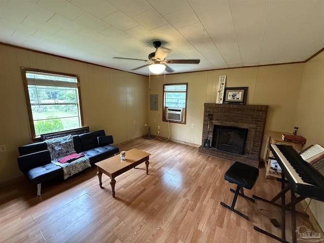 1159 Twin Bridges Rd, Flomaton, AL 36441 - living area with cooling unit, wood finished floors, ceiling fan, a fireplace, and ornamental molding