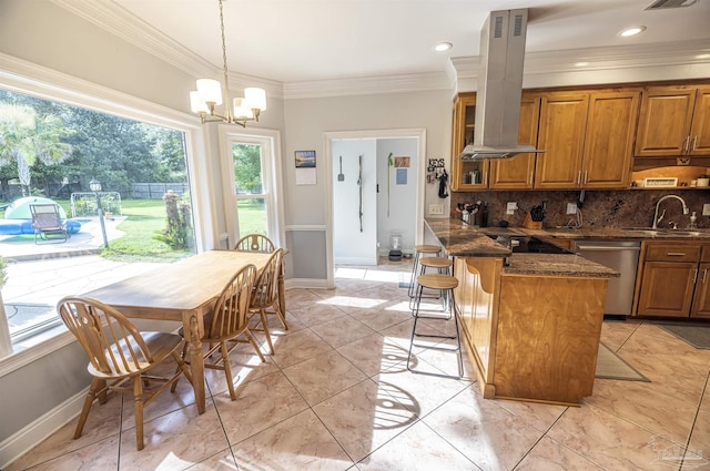 5013 Roland Rd, Pace, FL 32571 - kitchen featuring dishwasher, island range hood, brown cabinetry, backsplash, and a chandelier