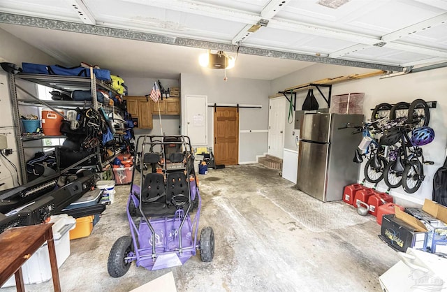 5013 Roland Rd, Pace, FL 32571 - garage with freestanding refrigerator and a garage door opener