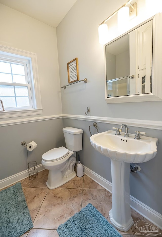 5013 Roland Rd, Pace, FL 32571 - bathroom with toilet and baseboards