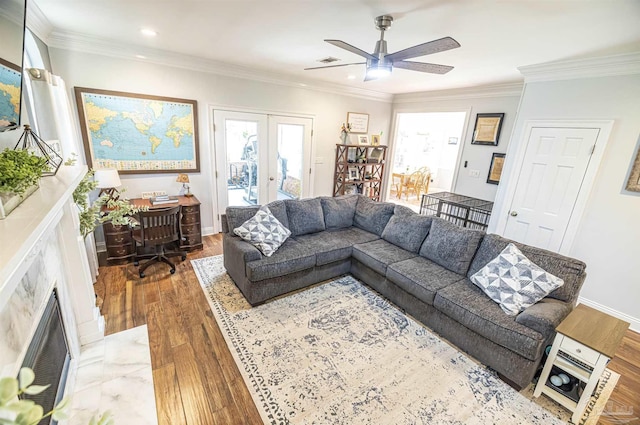 5013 Roland Rd, Pace, FL 32571 - living area featuring french doors, plenty of natural light, a premium fireplace, wood finished floors, and recessed lighting