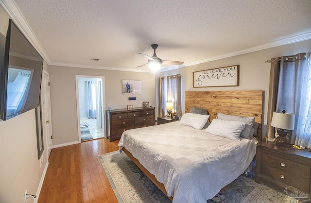 5013 Roland Rd, Pace, FL 32571 - bedroom with a textured ceiling, hardwood / wood-style flooring, crown molding, and ceiling fan