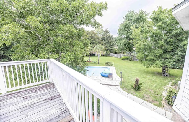 5013 Roland Rd, Pace, FL 32571 - deck featuring a yard, a swimming pool, and view of wooded area