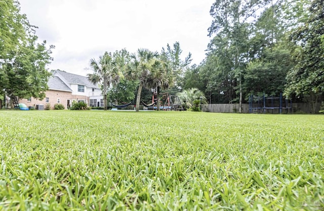 5013 Roland Rd, Pace, FL 32571 - view of yard with a trampoline
