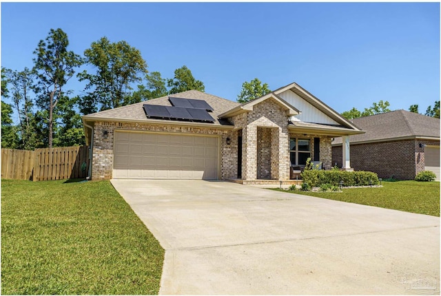 ranch-style house featuring a front yard, brick siding, and fence