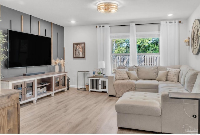 living room with light wood-style flooring, recessed lighting, and baseboards