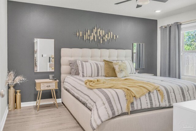 bedroom featuring recessed lighting, baseboards, a ceiling fan, and wood finished floors
