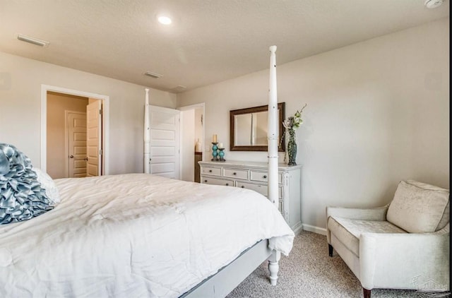 bedroom featuring light carpet, recessed lighting, visible vents, and baseboards