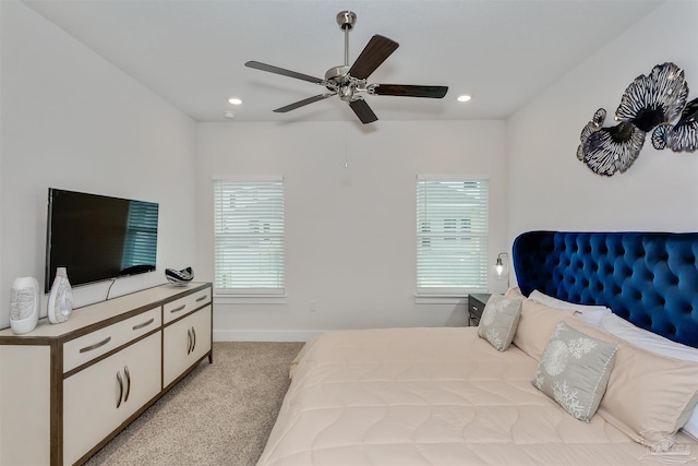 bedroom featuring light carpet, multiple windows, and recessed lighting