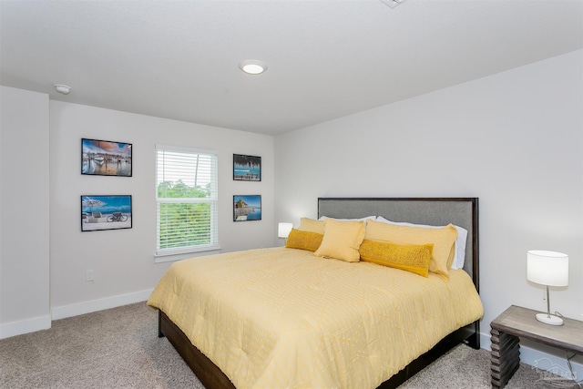 carpeted bedroom with baseboards