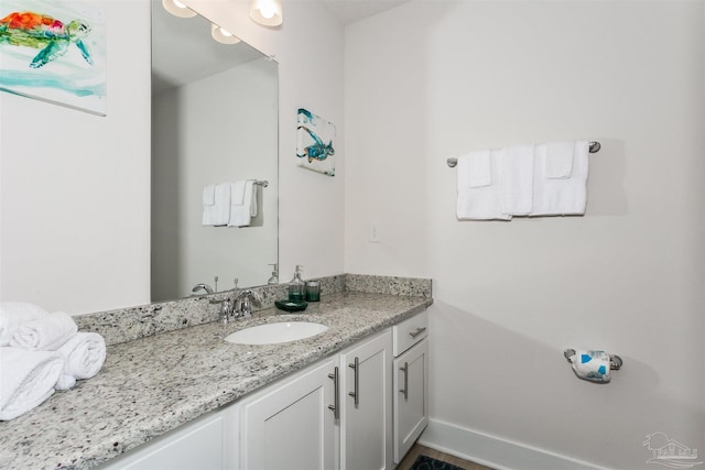 bathroom featuring vanity and baseboards