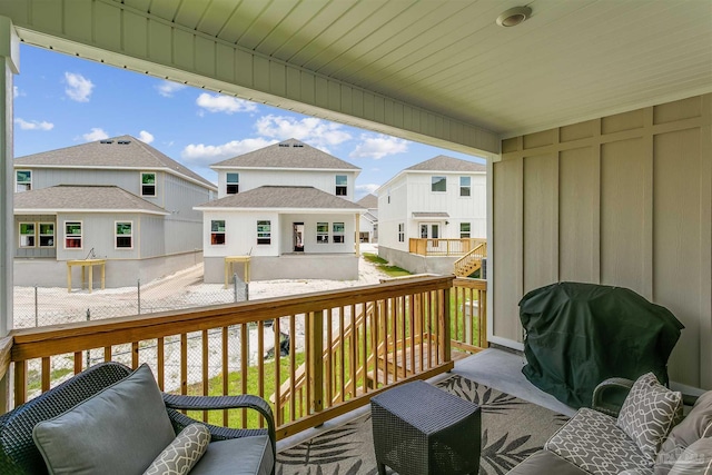 deck with grilling area and a residential view