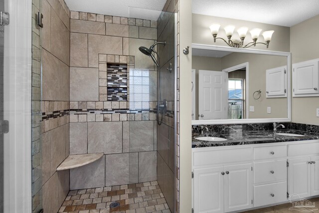full bathroom featuring a sink and a shower stall