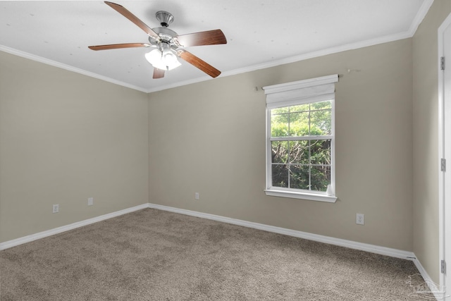 spare room featuring carpet flooring, baseboards, ornamental molding, and a ceiling fan