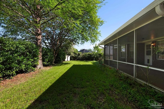 view of yard with a sunroom